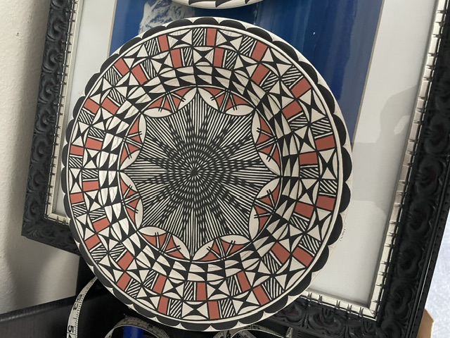 Fine-line platter with a radiating star center in ember and black